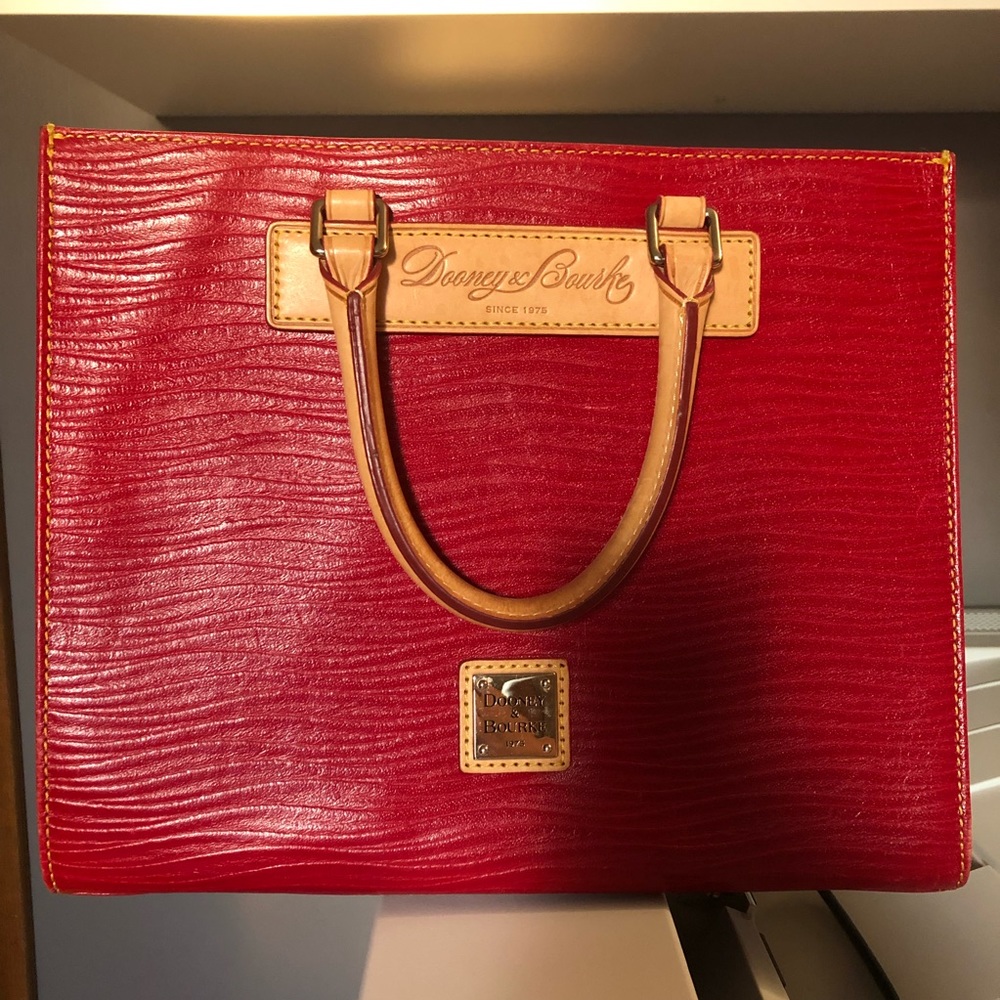 Dooney and Burke handbag red texture with tan leather handles